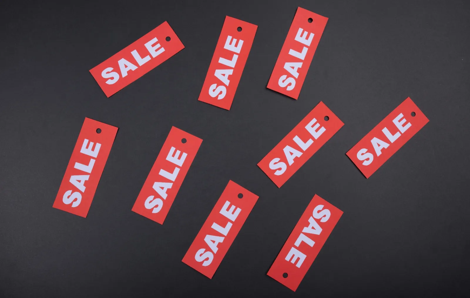 Sale tags representing sales recruiting fee models and pricing structures