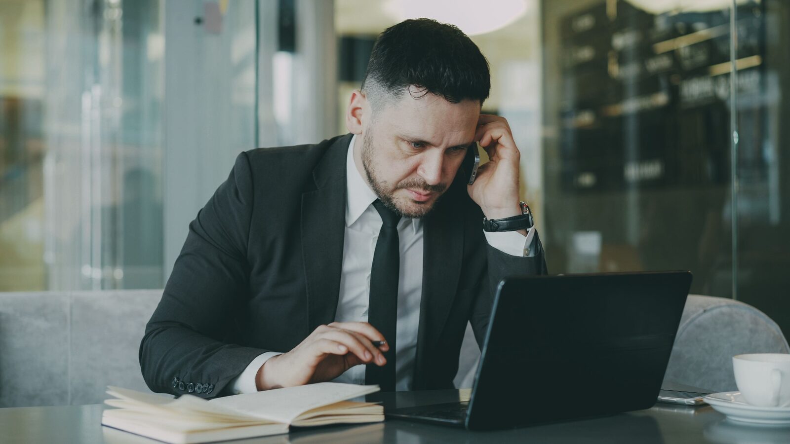 An AI sales leader taking a call during a candidate debrief
